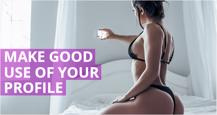 Woman on bed taking selfie